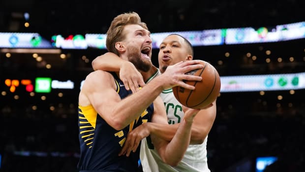 Jan 10, 2022; Boston, Massachusetts, USA; Boston Celtics forward Grant Williams (12) fouls Indiana Pacers forward Domantas Sabonis (11) in the second quarter at TD Garden. Mandatory Credit: David Butler II-USA TODAY Sports
